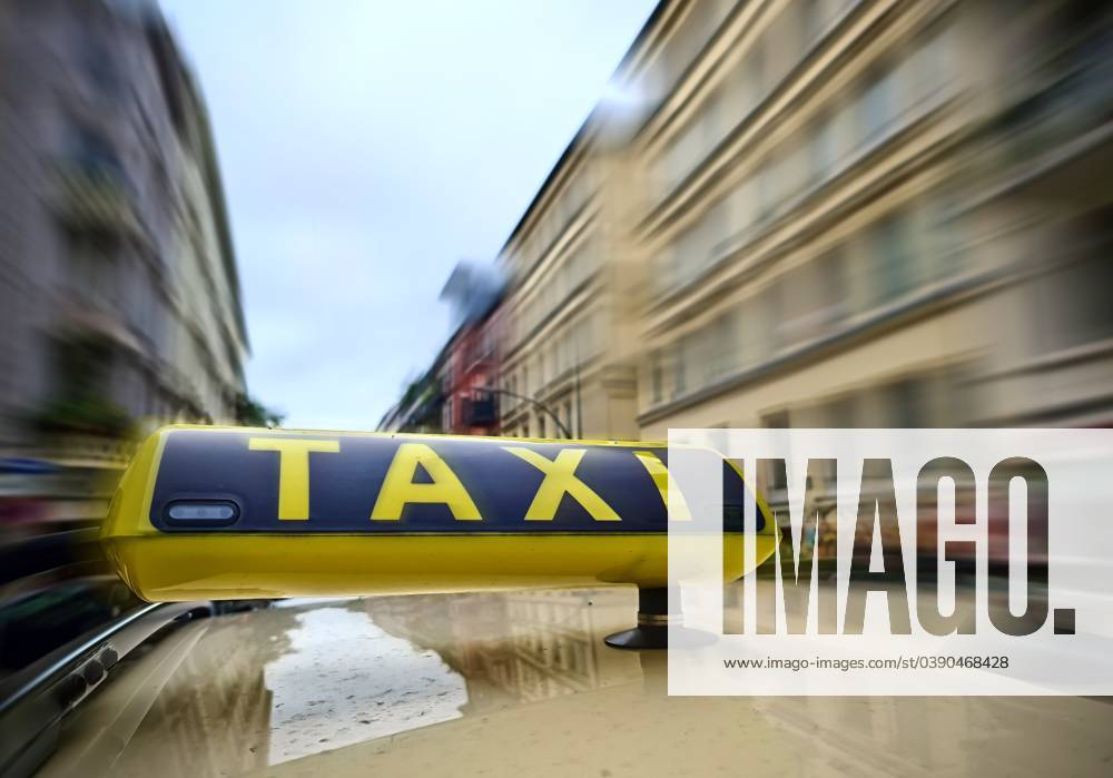 a Taxi Shield at a Car with much Motion blur at the Municipalities ...