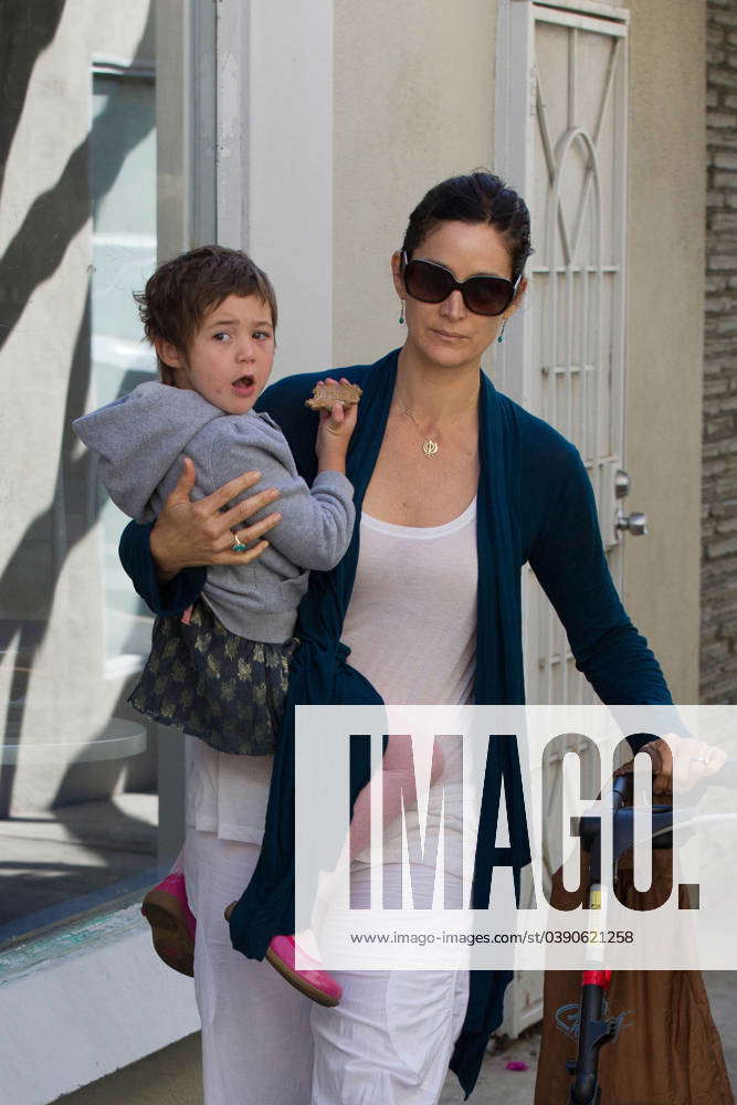 Carrie Anne Moss takes her daughter Frances Beatrice Roy to the