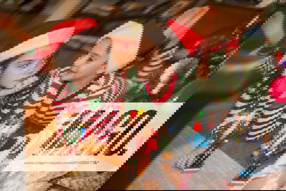 Twins goof around the christmas tree Long Branch, New Jersey, United States