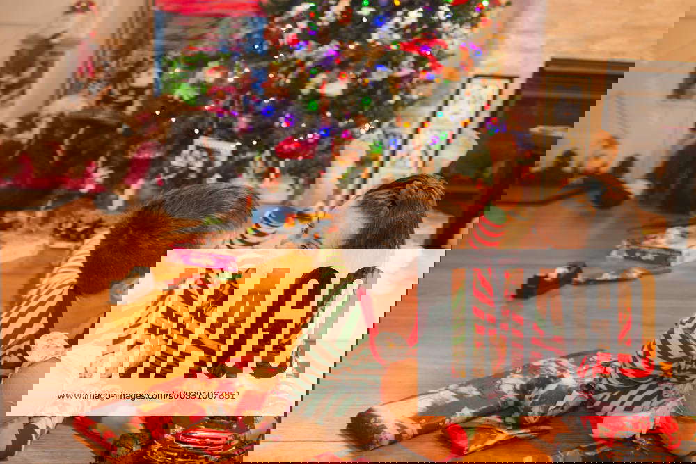 Twins goof around the christmas tree Long Branch, New Jersey, United States