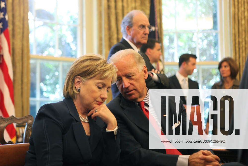 Clinton and Biden Secretary of State Hillary Rodham Clinton listens to ...