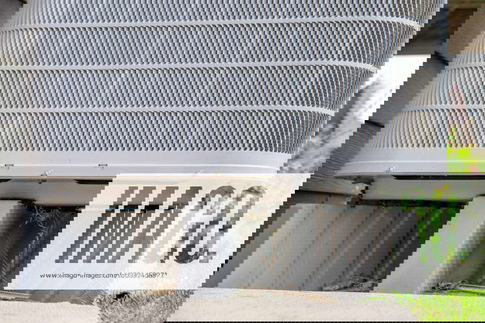 Selective focus on an air conditioner pad to level and hold the unit