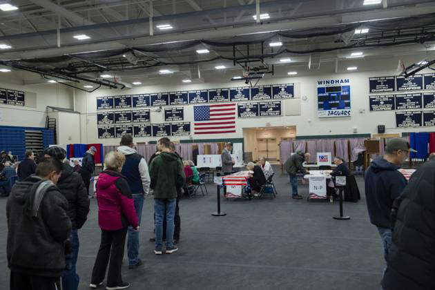 Voters Wait In Line To Collect Their Ballots And Cast Votes In The New ...