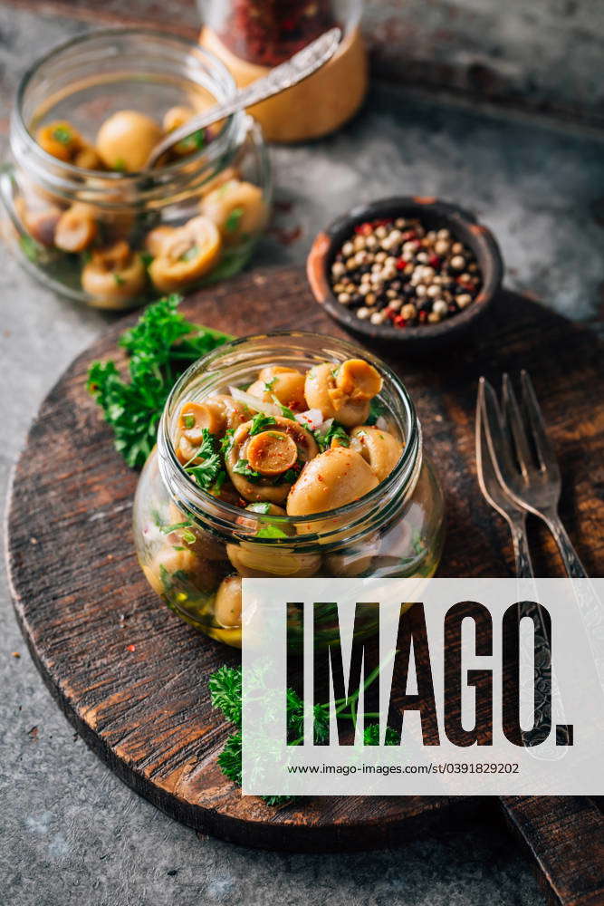 Homemade pickled mushrooms in a jar with spices Homemade pickled ...