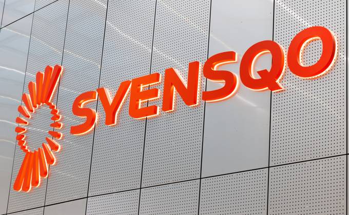 The logo of Syensqo is seen against a wall at the opening of the ...