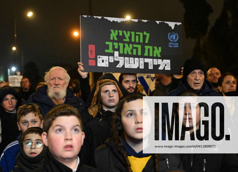 Right-wing Israeli Jews hold placards against the United Nations Relief ...