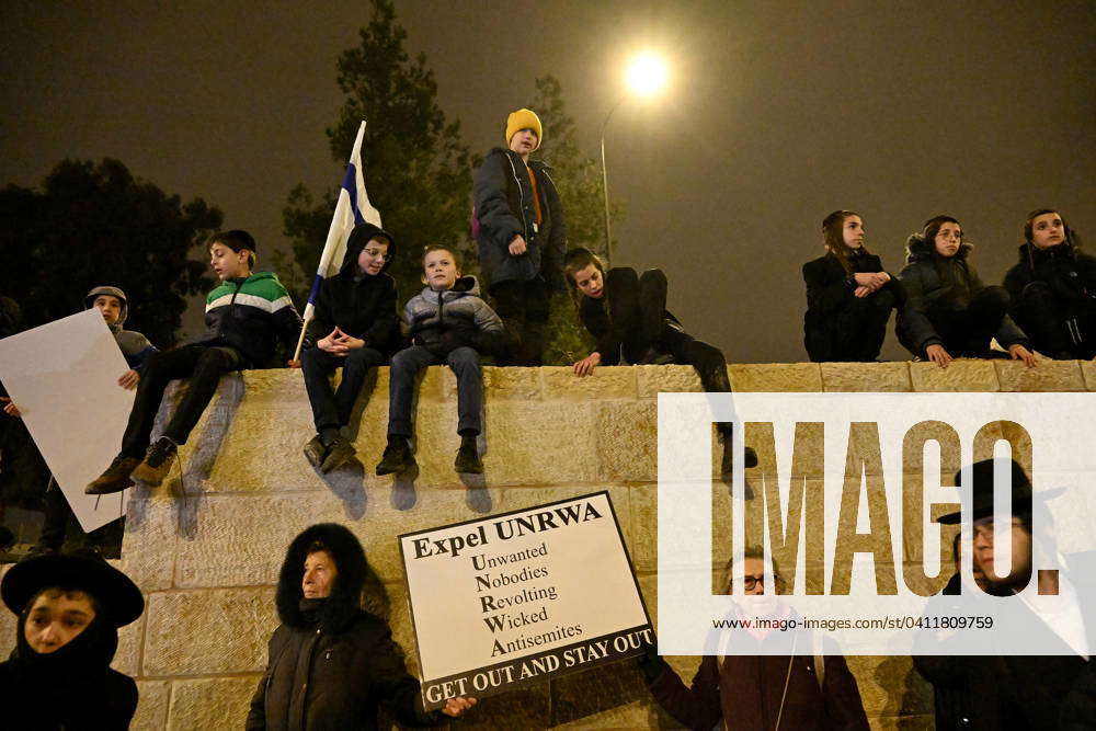 Right-wing Israeli Jews hold placards against the United Nations Relief ...