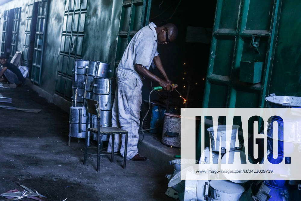 Kenya Jua Kali artisans in Nakuru, Kenya - 6 Feb 2024 A welder works at ...