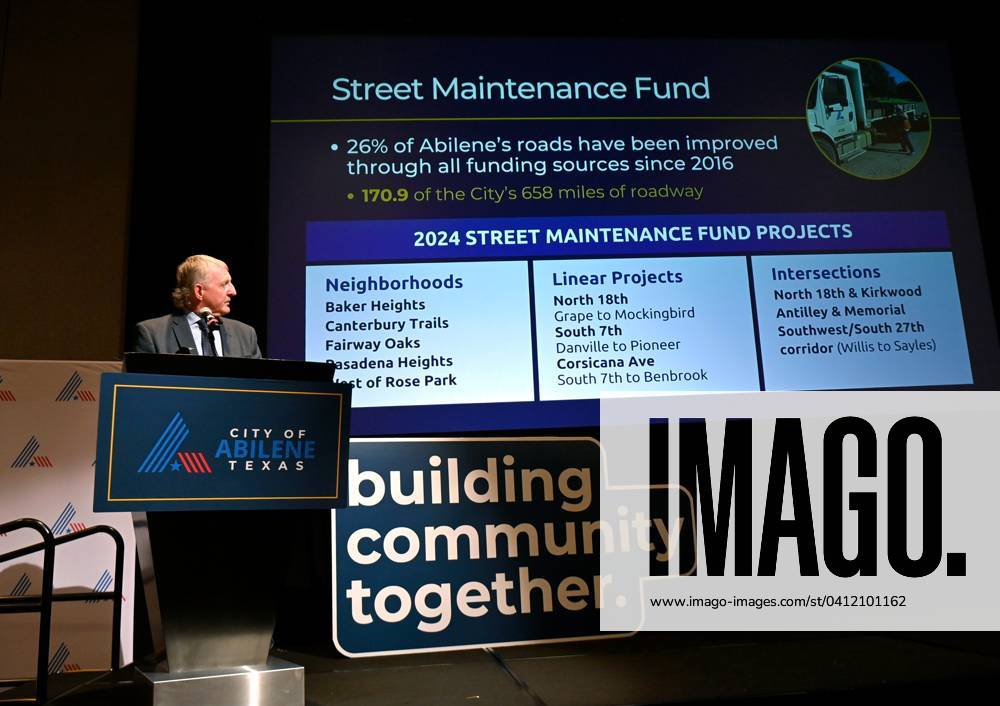 Syndication The Abilene ReporterNews Abilene Mayor Weldon Hurt glances at one of the slides in