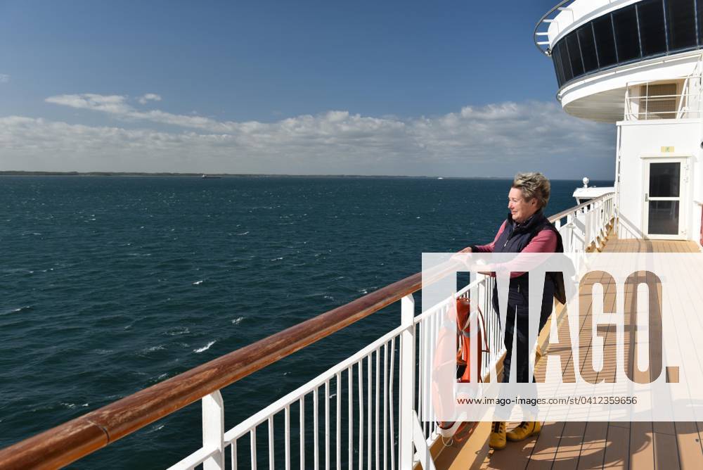 Woman is to the Railing one ship, Ferry in the Baltic Sea