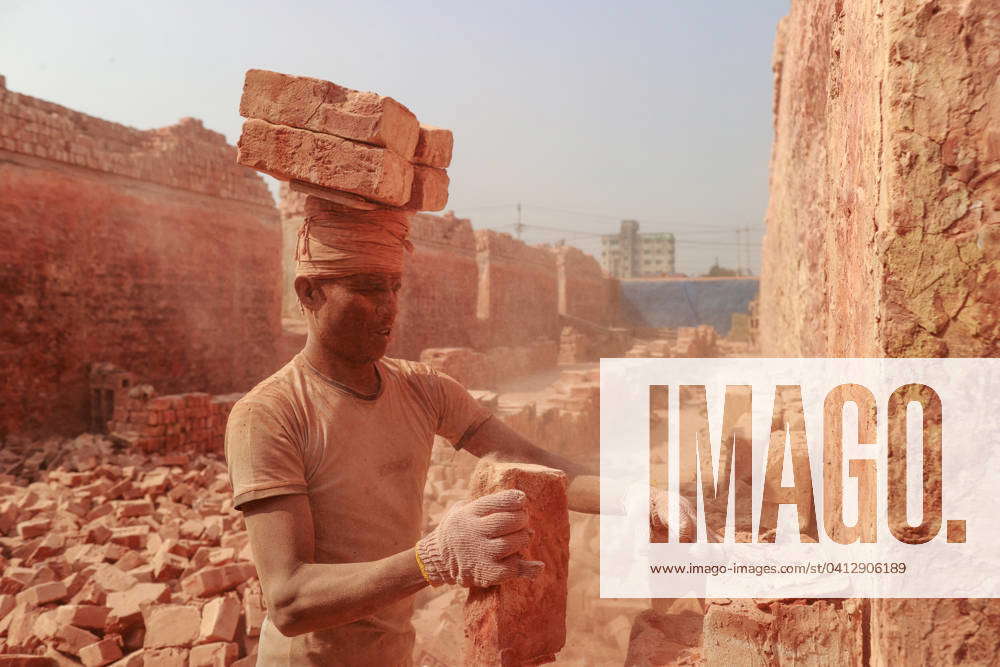 February 10, 2024, Narayanganj, Bangladesh: Bangladeshi men work at a ...