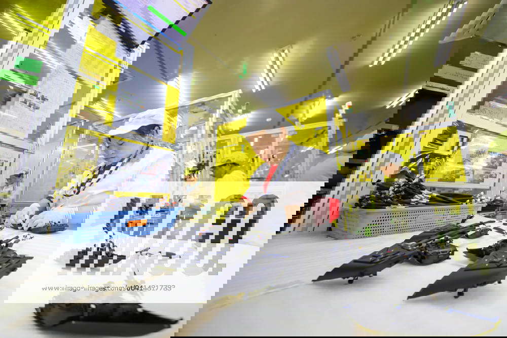 An Automotive Electronics Company in Qingdao A worker is setting up