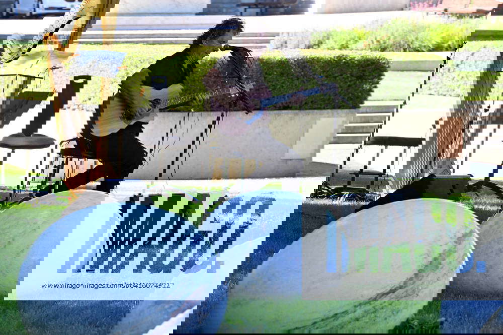 DEDICATION OF NEW SCULPTURE AT AUSTRALIAN WAR, Cold Chisel guitarist