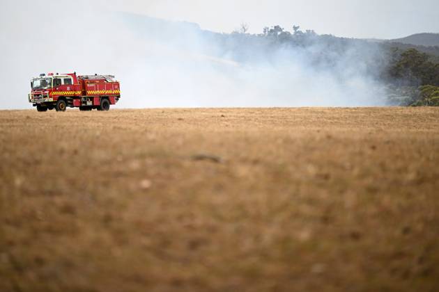 BUSHFIRES VICTORIA, A CFA fire truck is seen near a fire outside of ...