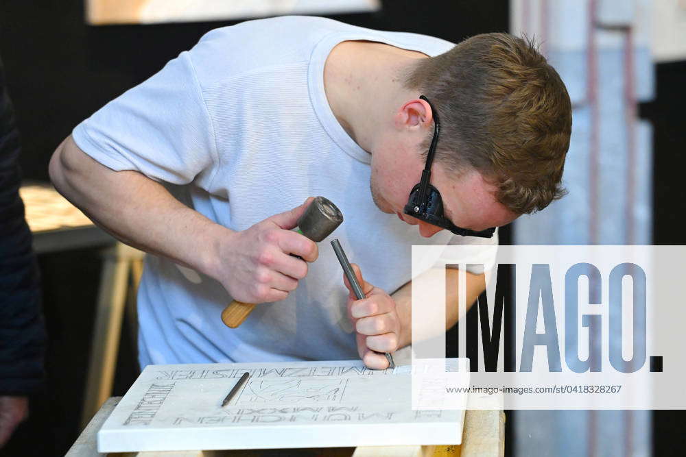 Male apprentice stonemason at work 75 years International Craft Fair ...