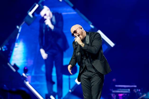 American hip hop and pop artist, Pitbull, performs on stage as part of ...