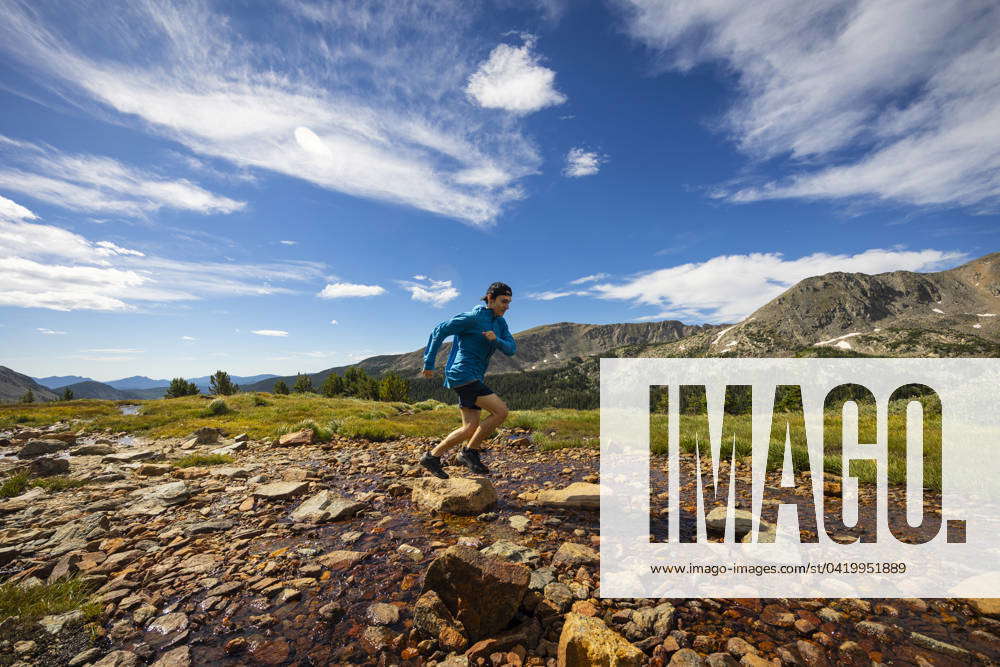 Trail runner on the trail up to Arapahoe Pass in Colorado. Nederland ...