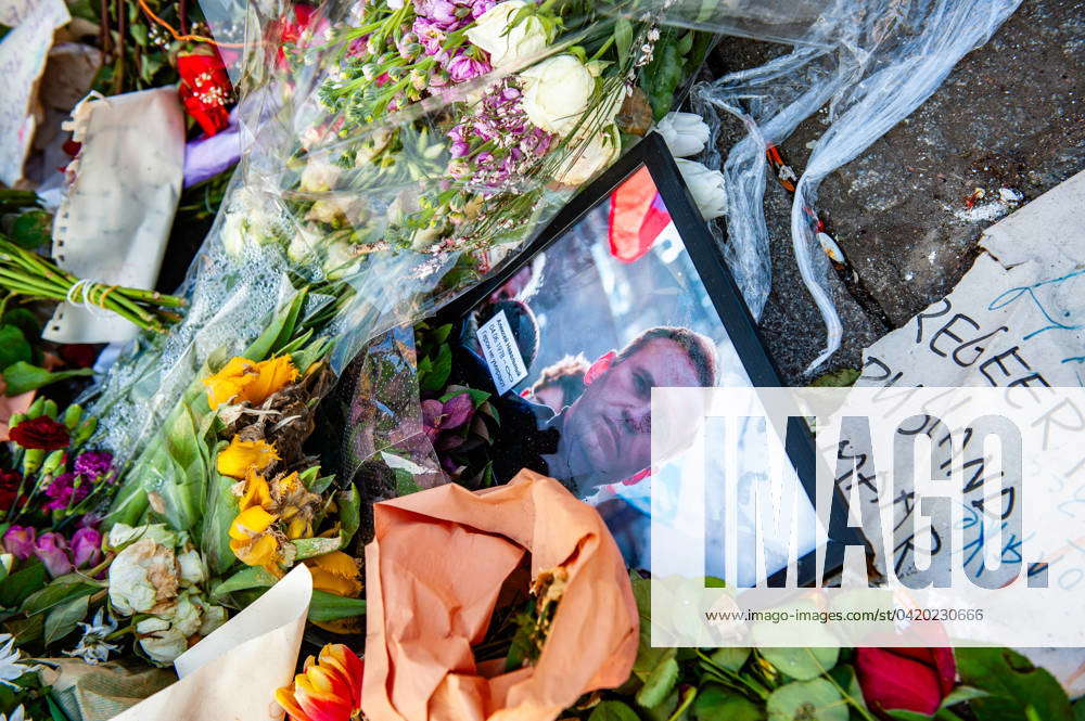 Flowers in memory of Navalny in Amsterdam. A portrait of Alexei Navalny ...