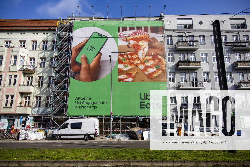 A huge billboard from the delivery service Uber Eats stands in front of ...