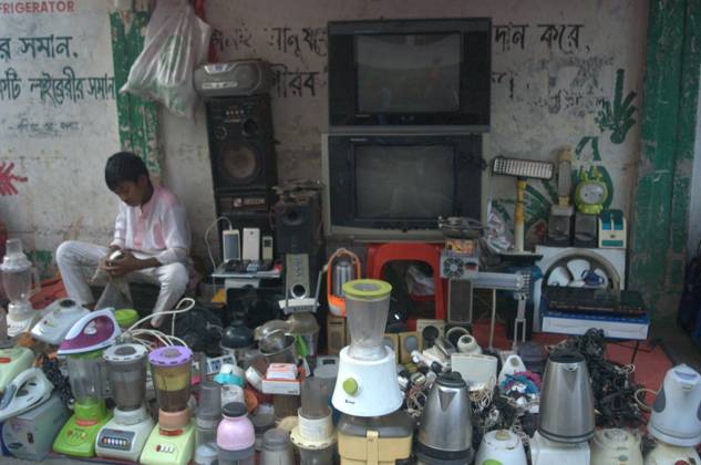 March 14, 2024, Dhaka, Bangladesh: A vendor waits for customers as he ...