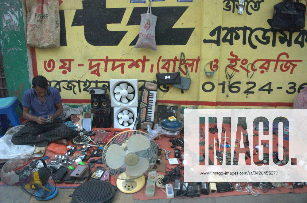 March 14, 2024, Dhaka, Bangladesh: A vendor waits for customers as he ...