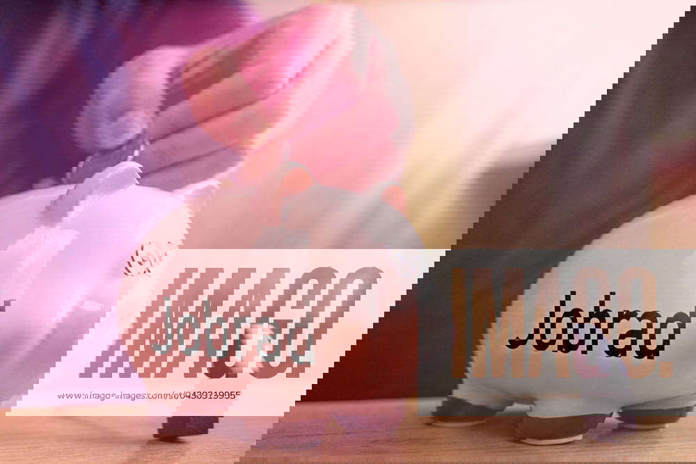 14 March 2024 Man throws euro coins into a piggy bank labeled Jobrad