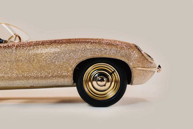 Gold E-Type Jaguar covered in 100,000 Swarovski crystal sells for just ...