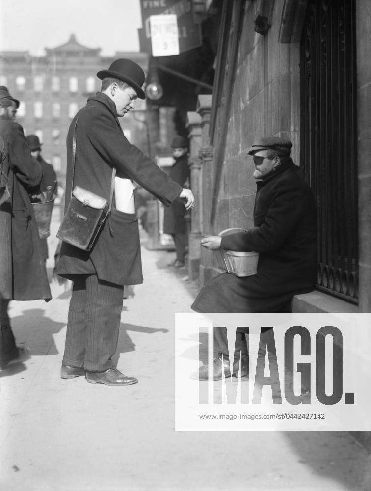 NYC: BEGGAR, c1915. A disfigured man begging in New York City ...