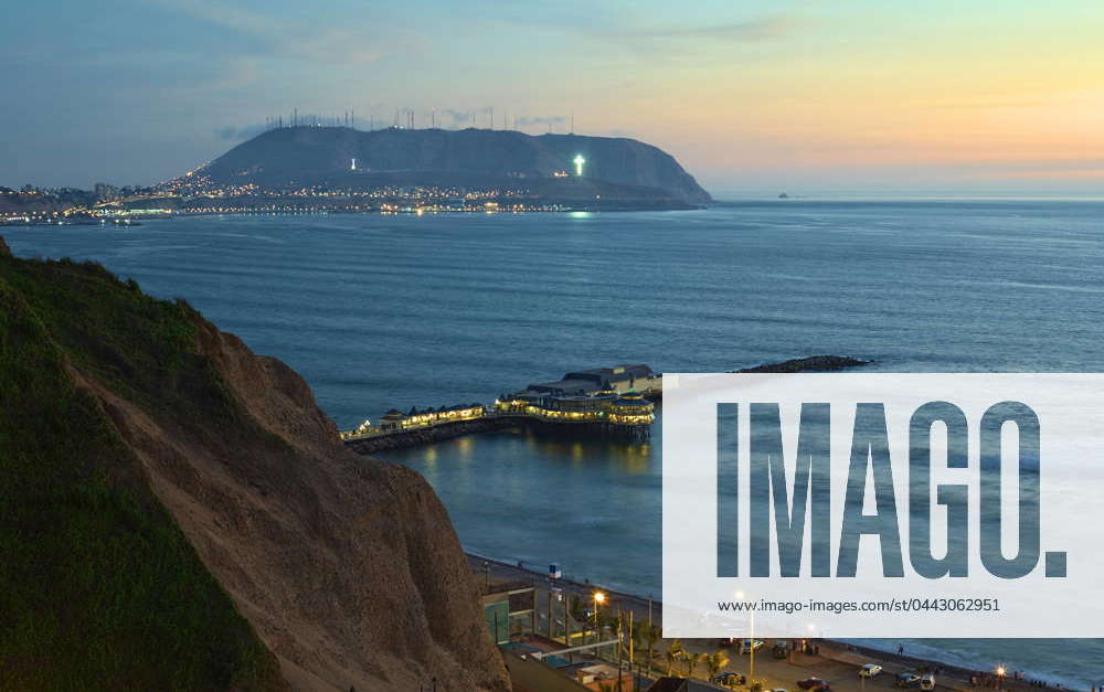 The coastline of Lima, Peru at twilight. On the pier the restaurant La ...