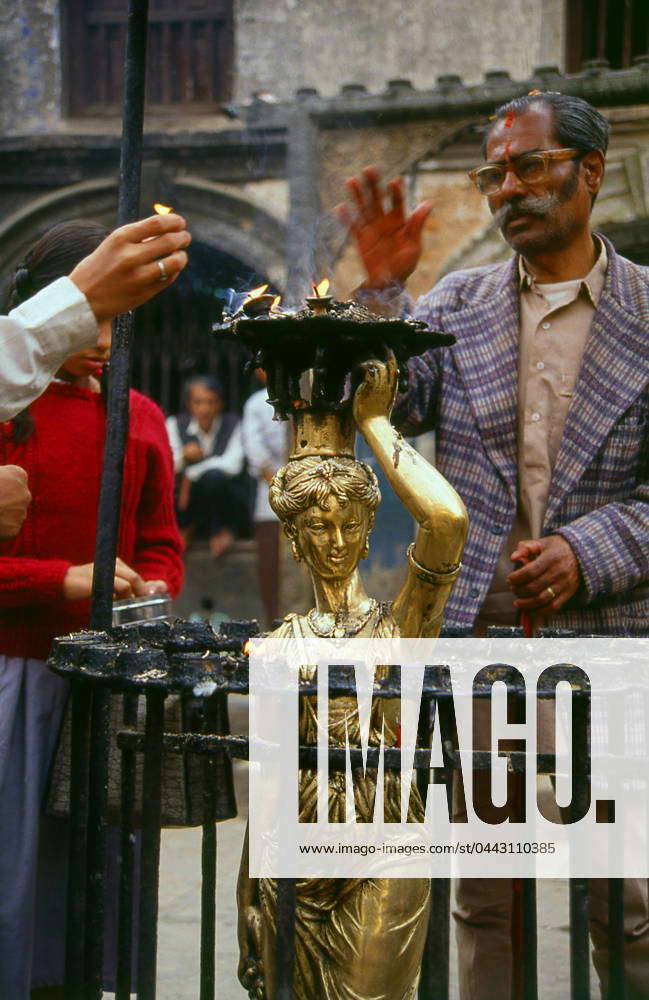 Nepal: Worshippers at a European-style statue, originally from the old ...