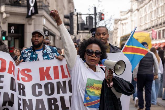 Congolese protest in London, UK - 06 Apr 2024 Protesters hold a banner ...