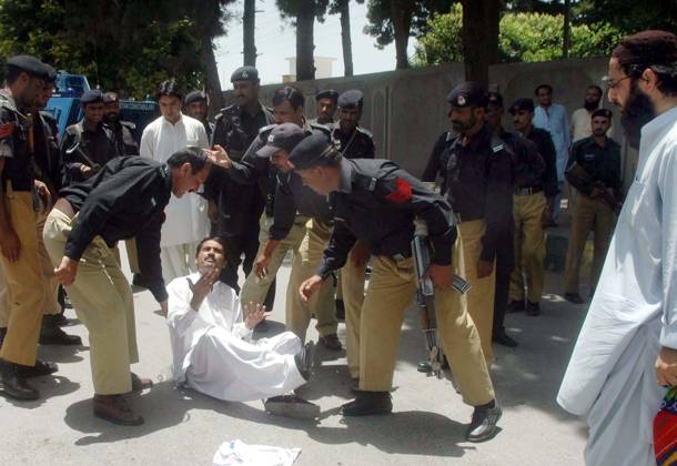 QUETTA, PAKISTAN, JUN 14: Policemen arrest protesters during protest ...