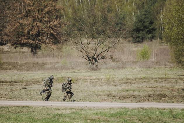 Two equipped soldiers, taken during an exercise of the Bundeswehr with ...
