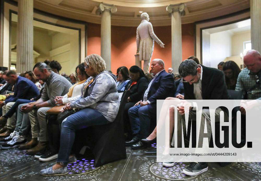 Syndication: The Courier-Journal Some bow their heads in prayer near ...