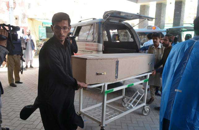 QUETTA, PAKISTAN, APR 13: Rescue officials shift dead bodies of victims ...