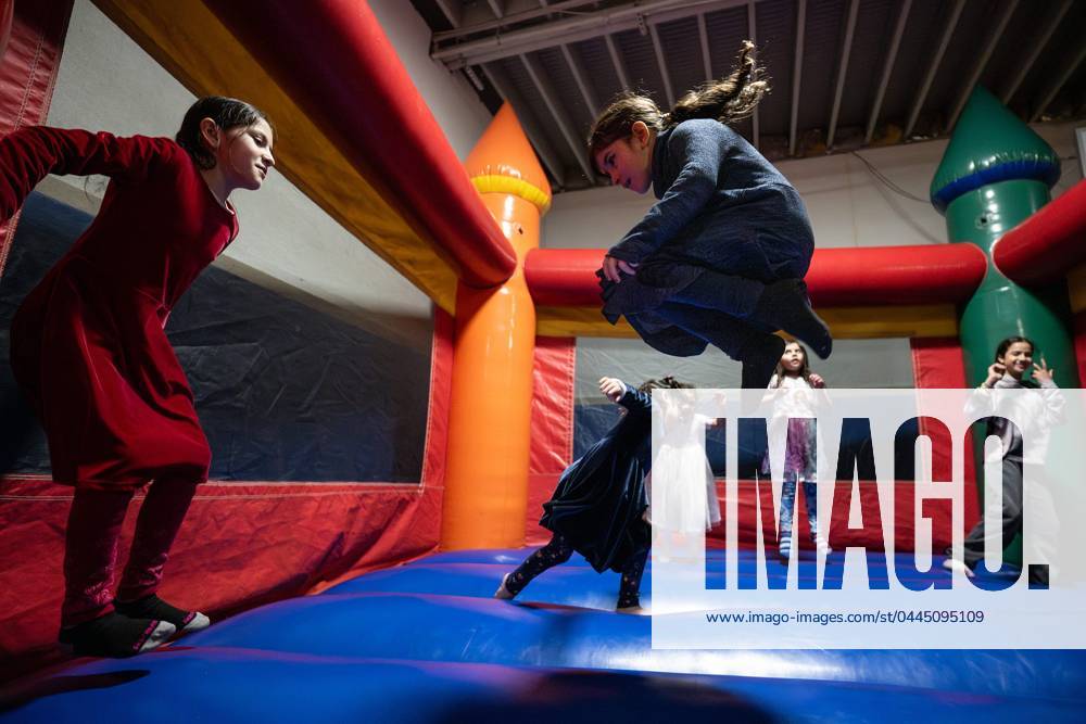 Syndication: Worcester Magazine Children enjoy a bouncy castle during ...