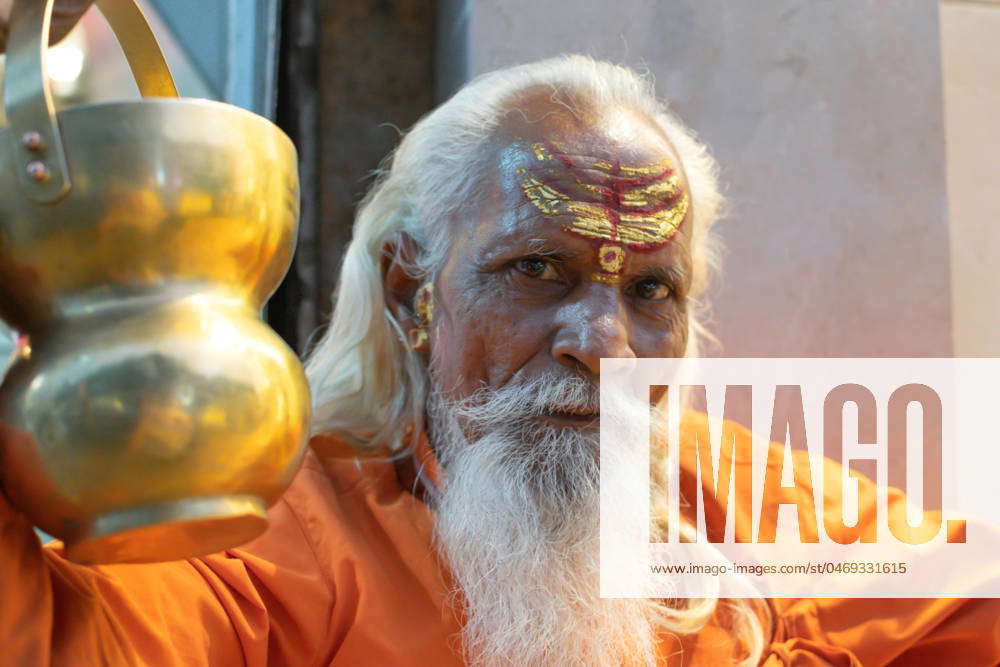 Ascetic monk Sadhu in India with beard, white hair and painted face ...