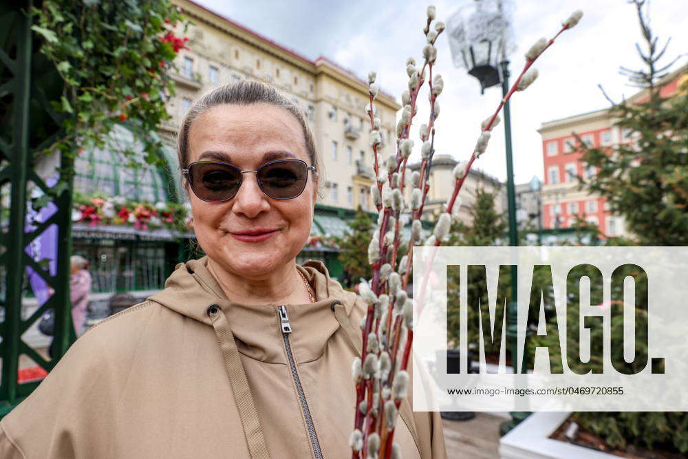 RUSSIA, MOSCOW APRIL 28, 2024 A woman holds willow twigs at the