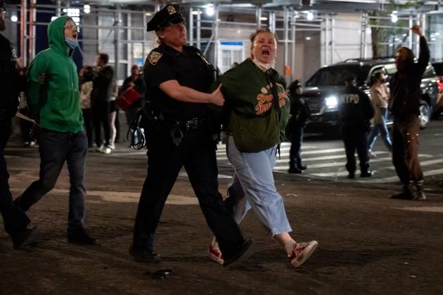 Two Protestors New York, Ny, United States: Two protesters lay down effigies of dead ...
