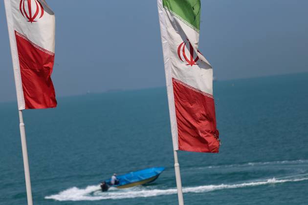 April 28, 2024, Bushehr, Iran: A boat is sailing as Iranian flag waves ...