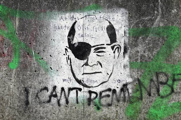 Graffito of Federal Chancellor Olaf Scholz with eye patch alluding to ...