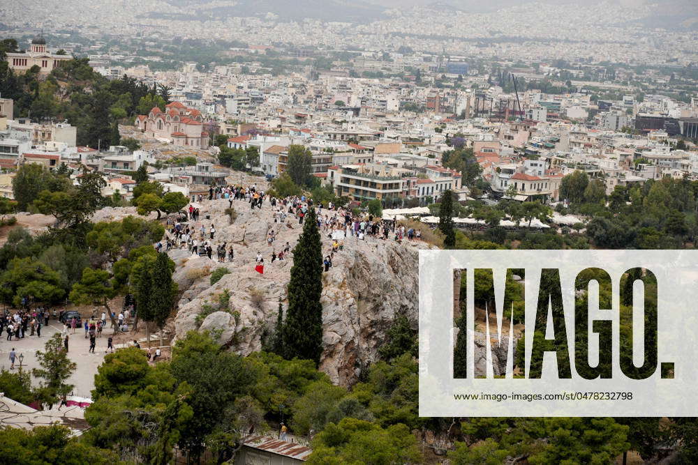 Daily Life In Athens Tourists are visiting the Acropolis in Athens ...