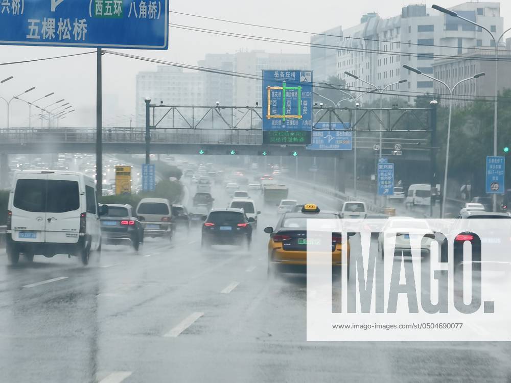 Rainy Gaokao in Beijing BEIJING, CHINA - JUNE 7, 2024 - Vehicles jam in ...