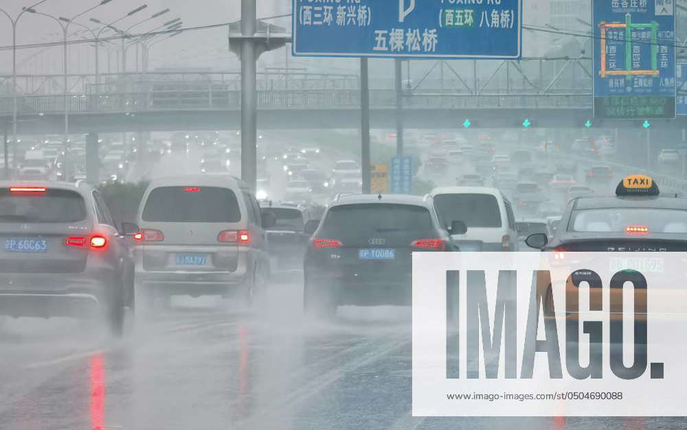 Rainy Gaokao in Beijing BEIJING, CHINA - JUNE 7, 2024 - Vehicles jam in ...