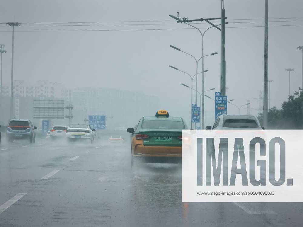 Rainy Gaokao in Beijing BEIJING, CHINA - JUNE 7, 2024 - Vehicles jam in ...