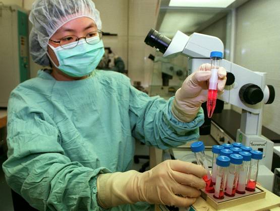 Ob Tech Obstetrics & Gynaecology technician Grace Tjer Ching-ching, takes an ...