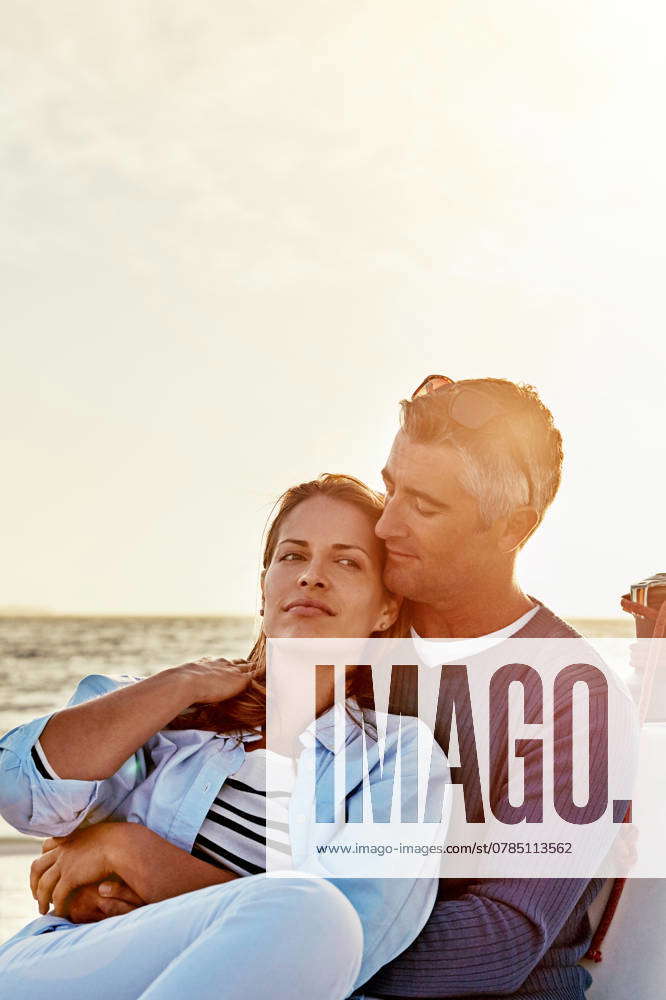 Sea, sunset or couple hug on boat on holiday, travel or vacation for ...