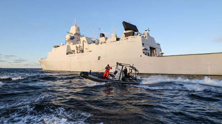 Operation Baltic Sentry A rib motor boat in pulls alongside the German ...